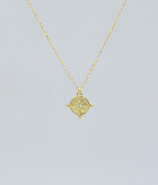 Gold sunburst talisman charm necklace