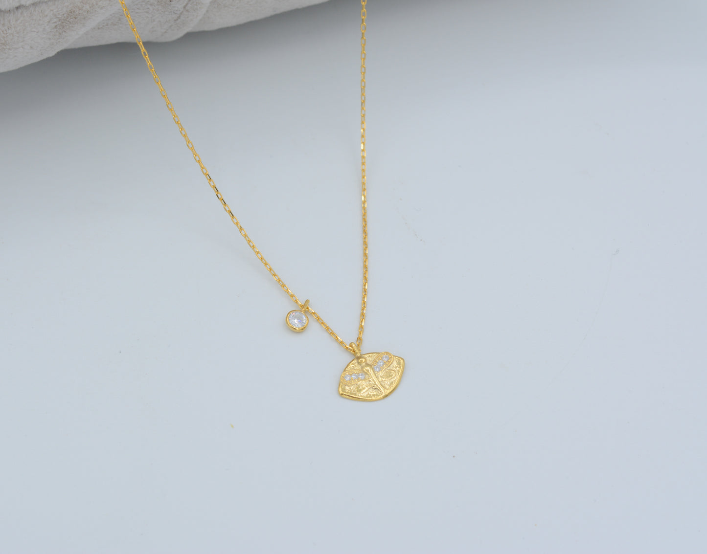 Gold dragonfly and cubic zirconia charm necklace