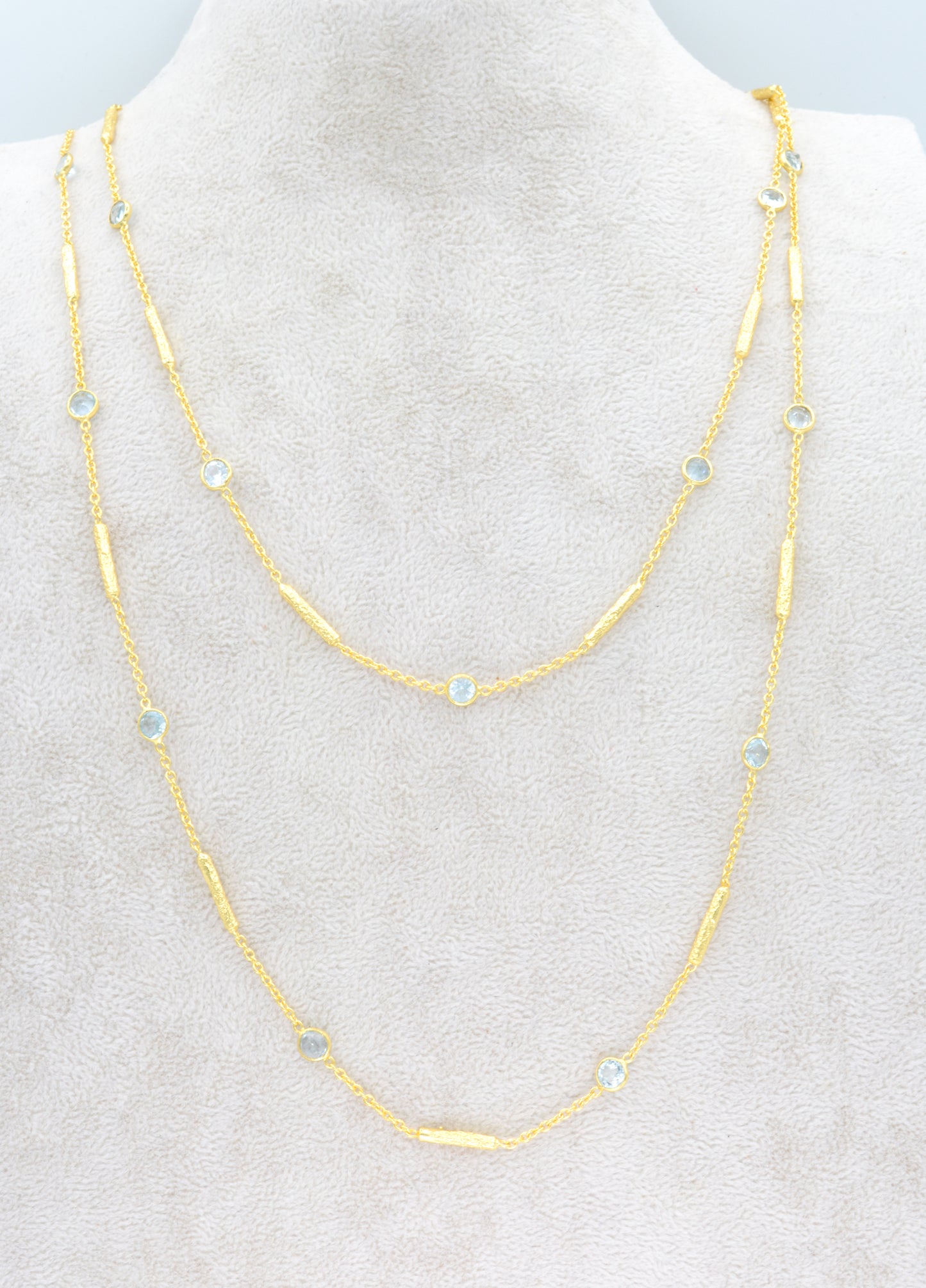 Long blue topaz necklace with textured tube spacers