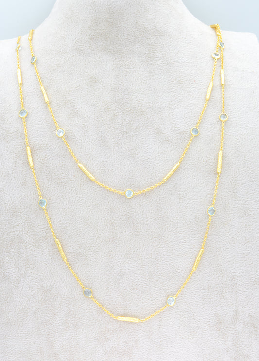 Long blue topaz necklace with textured tube spacers
