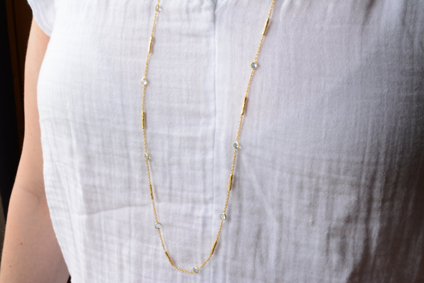 Long blue topaz necklace with textured tube spacers