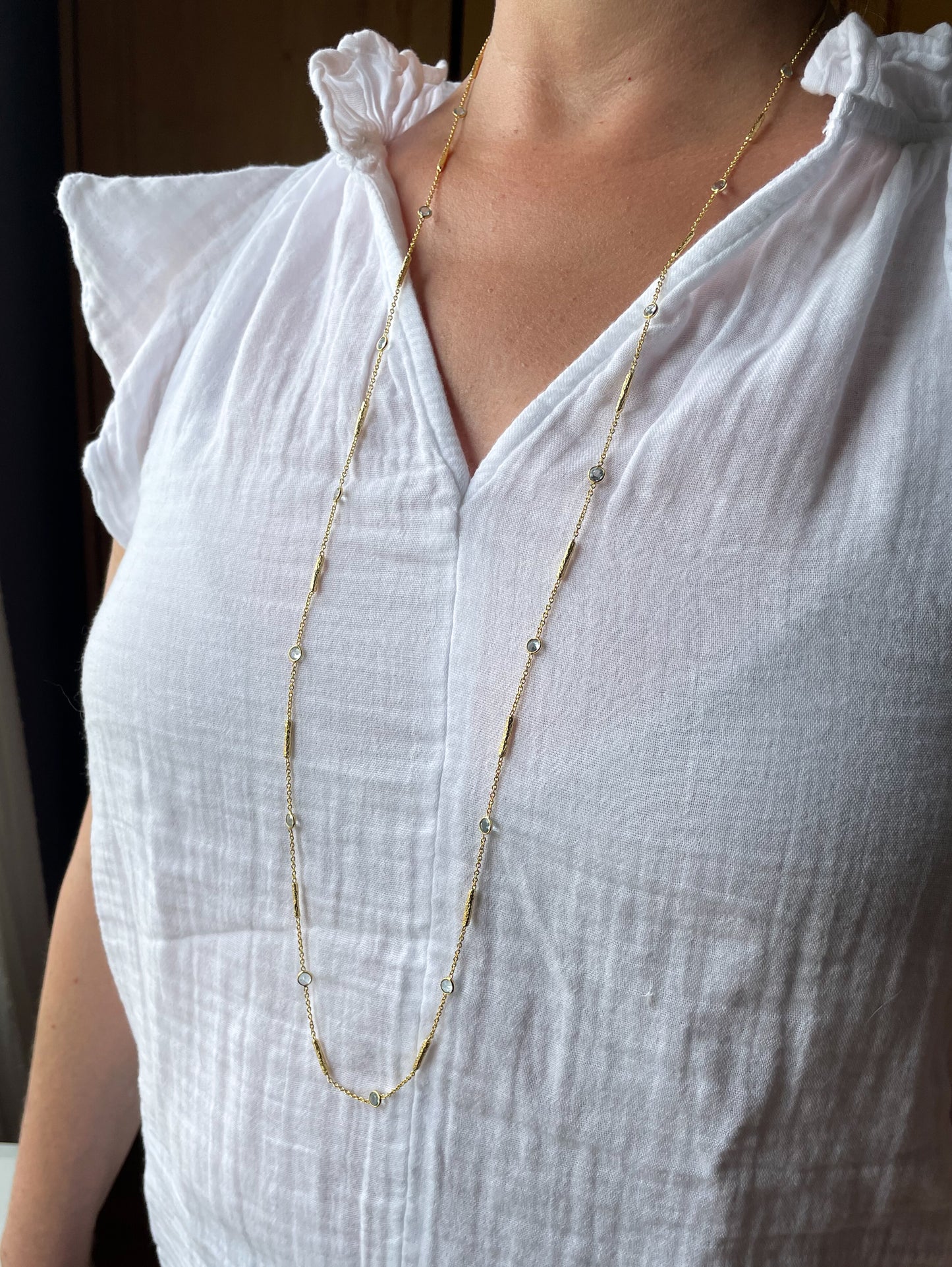Long blue topaz necklace with textured tube spacers