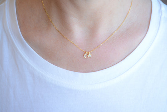 Gold necklace with cubic zirconia moon and star pendant