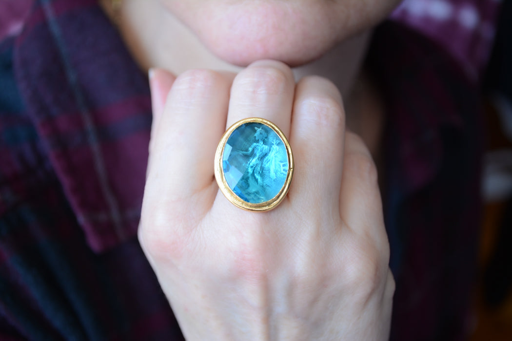 Adjustable gold coin ring with faceted turquoise crystal