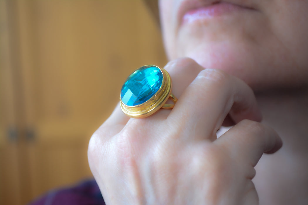 Adjustable gold coin ring with faceted turquoise crystal