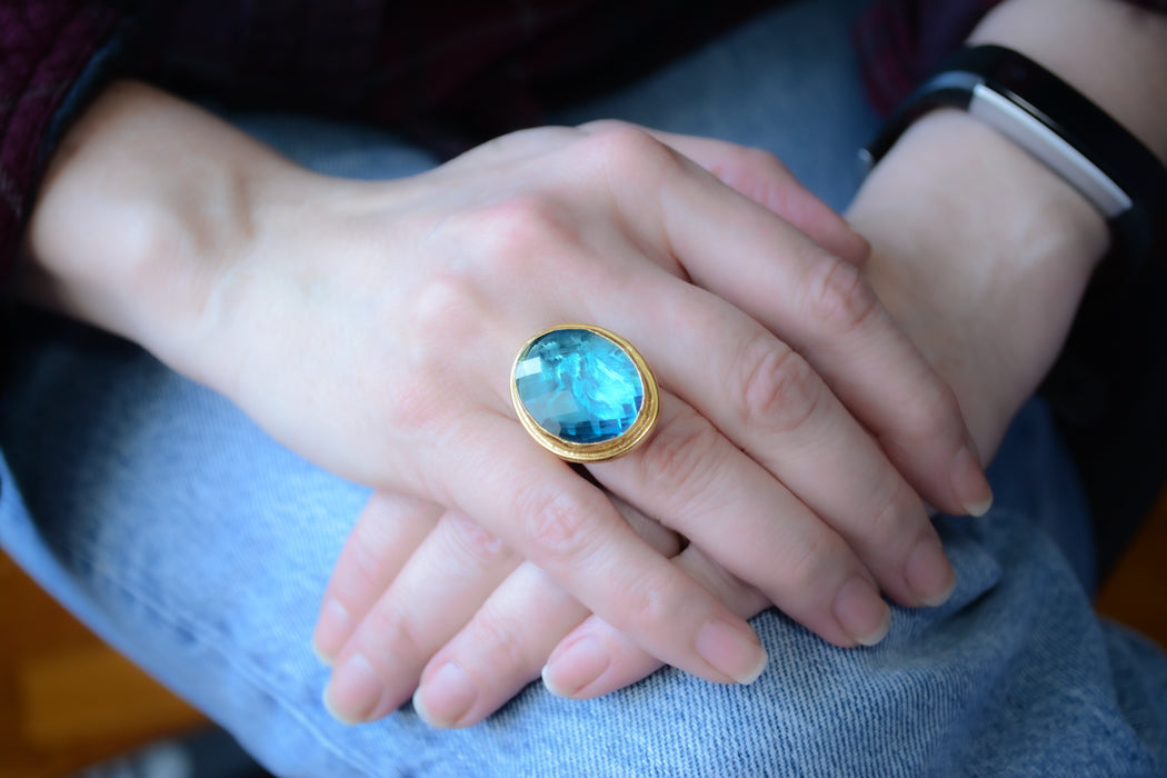 Adjustable gold coin ring with faceted turquoise crystal