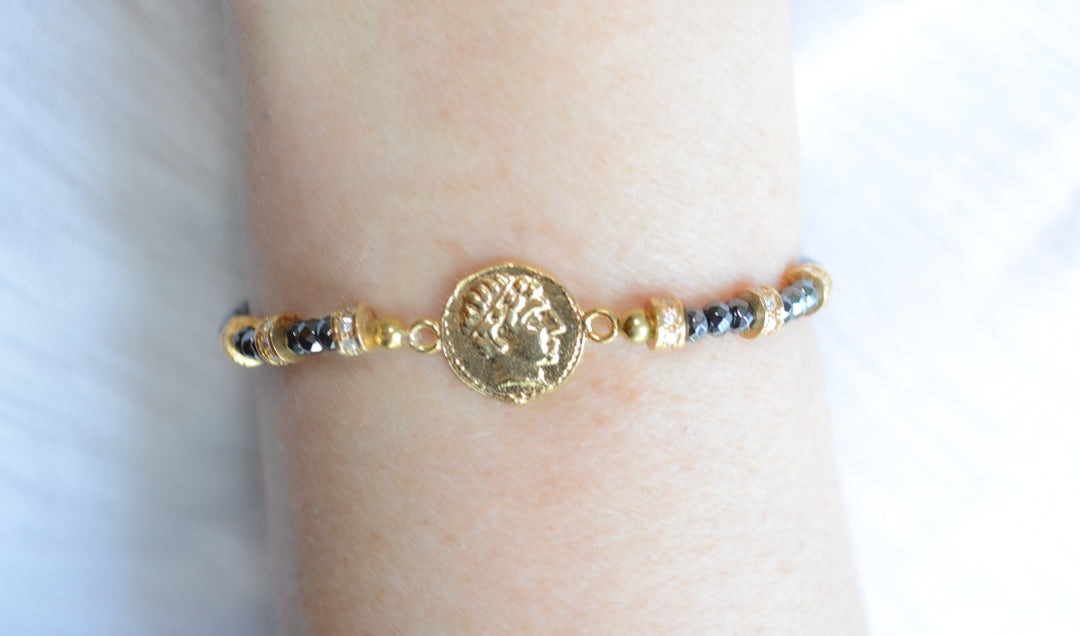 Faceted Hematite and Gold Plated coin bracelet with cz