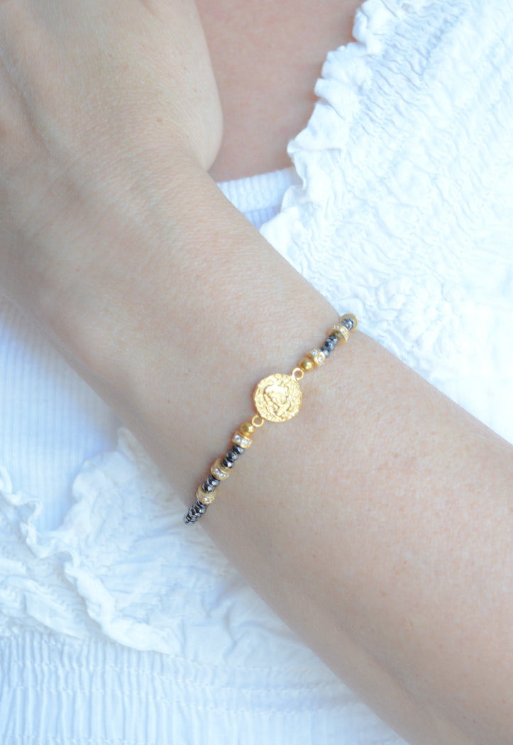 Faceted Hematite, and Gold Plated cz coin bracelet