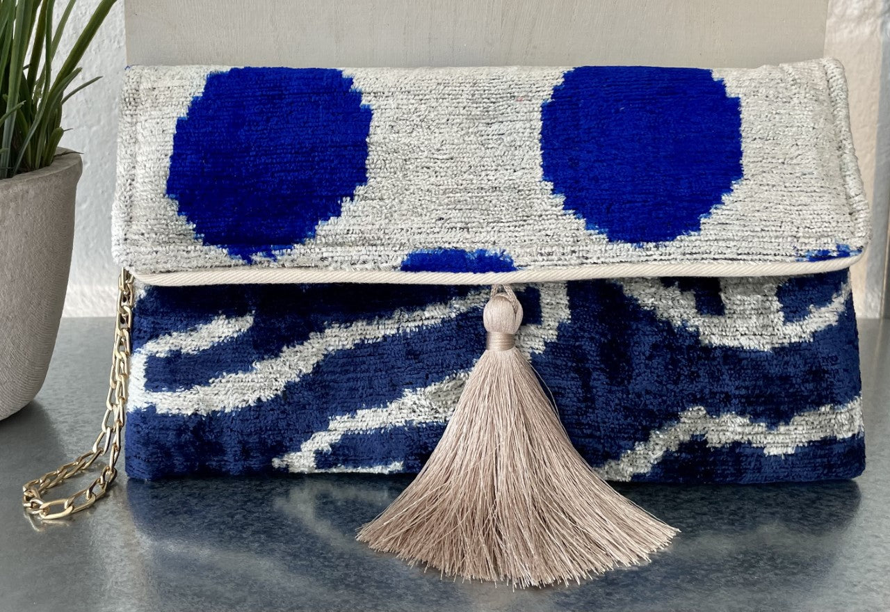 Handwoven silk and cotton clutch with hidden chain strap