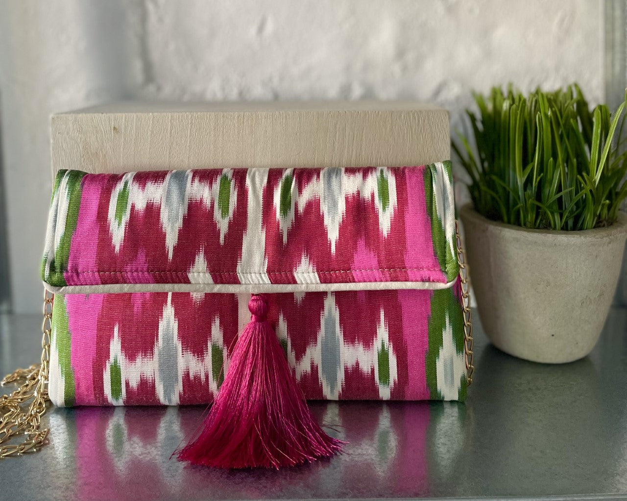 Handwoven Ikat clutch with hidden chain strap
