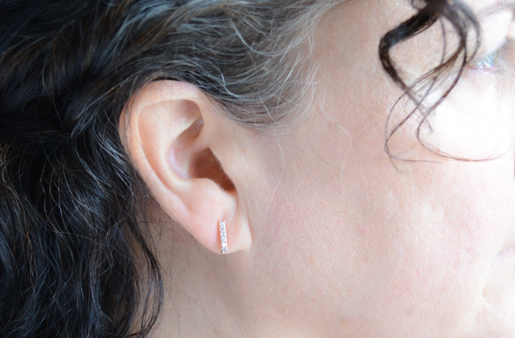 Rose gold plated pave cubic zirconia bar studs