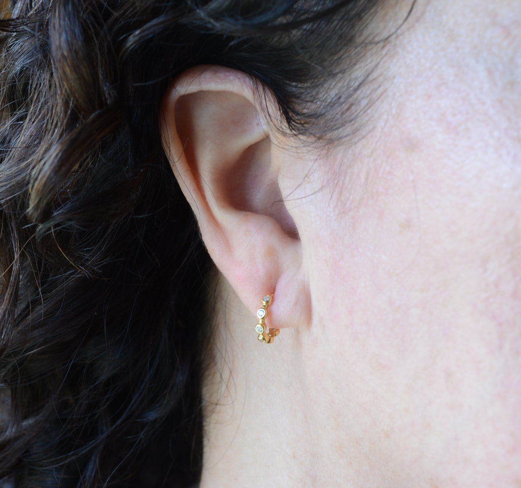 Tiny gold hoops with cubic zirconia