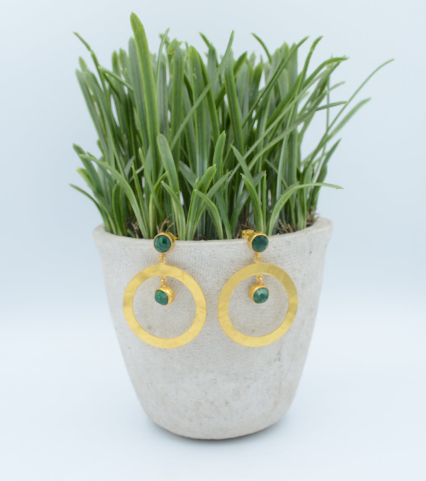 Hammered hoops with post and Emerald stones