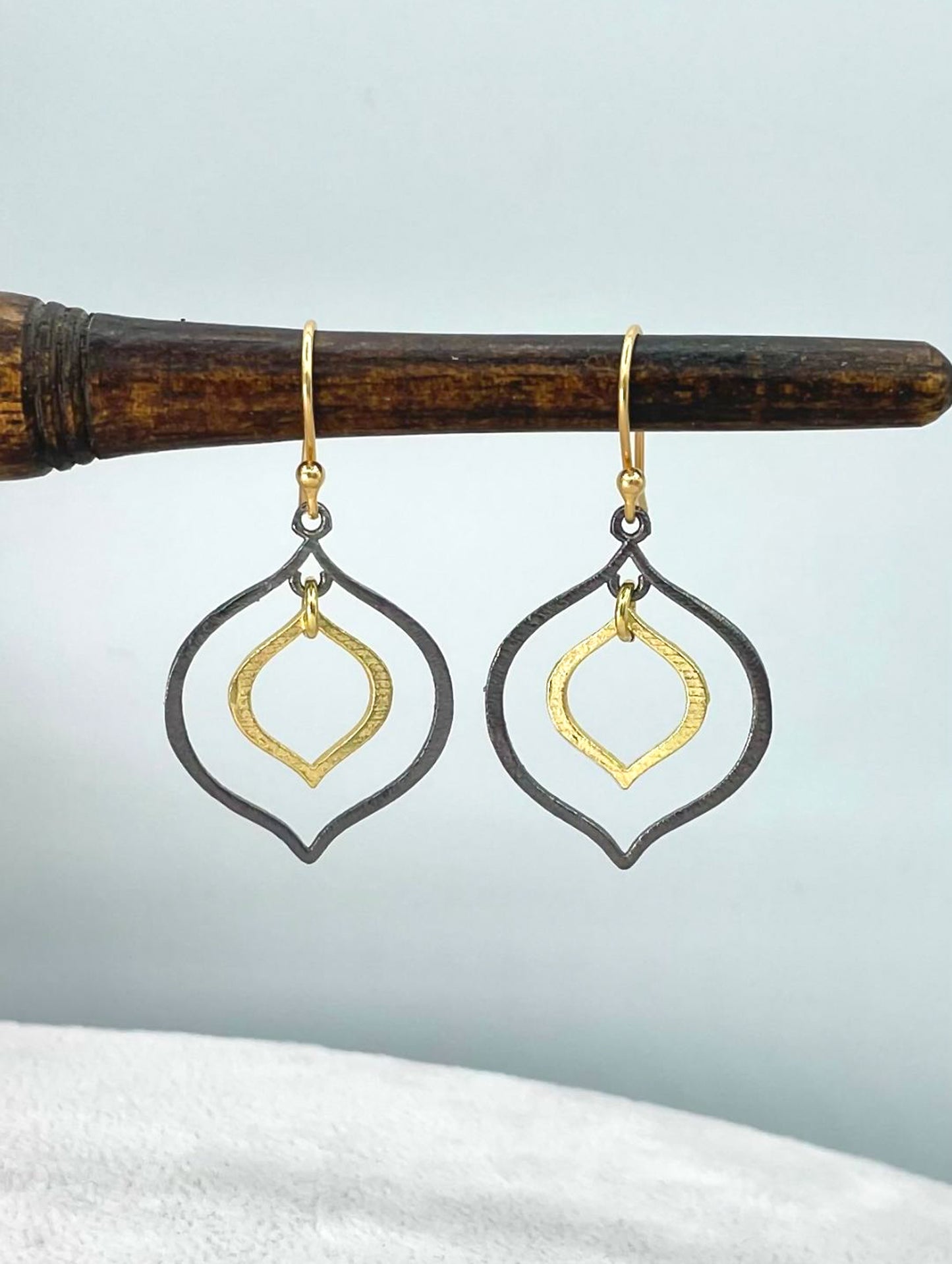 Two-tone gold and dark rhodium lotus earrings