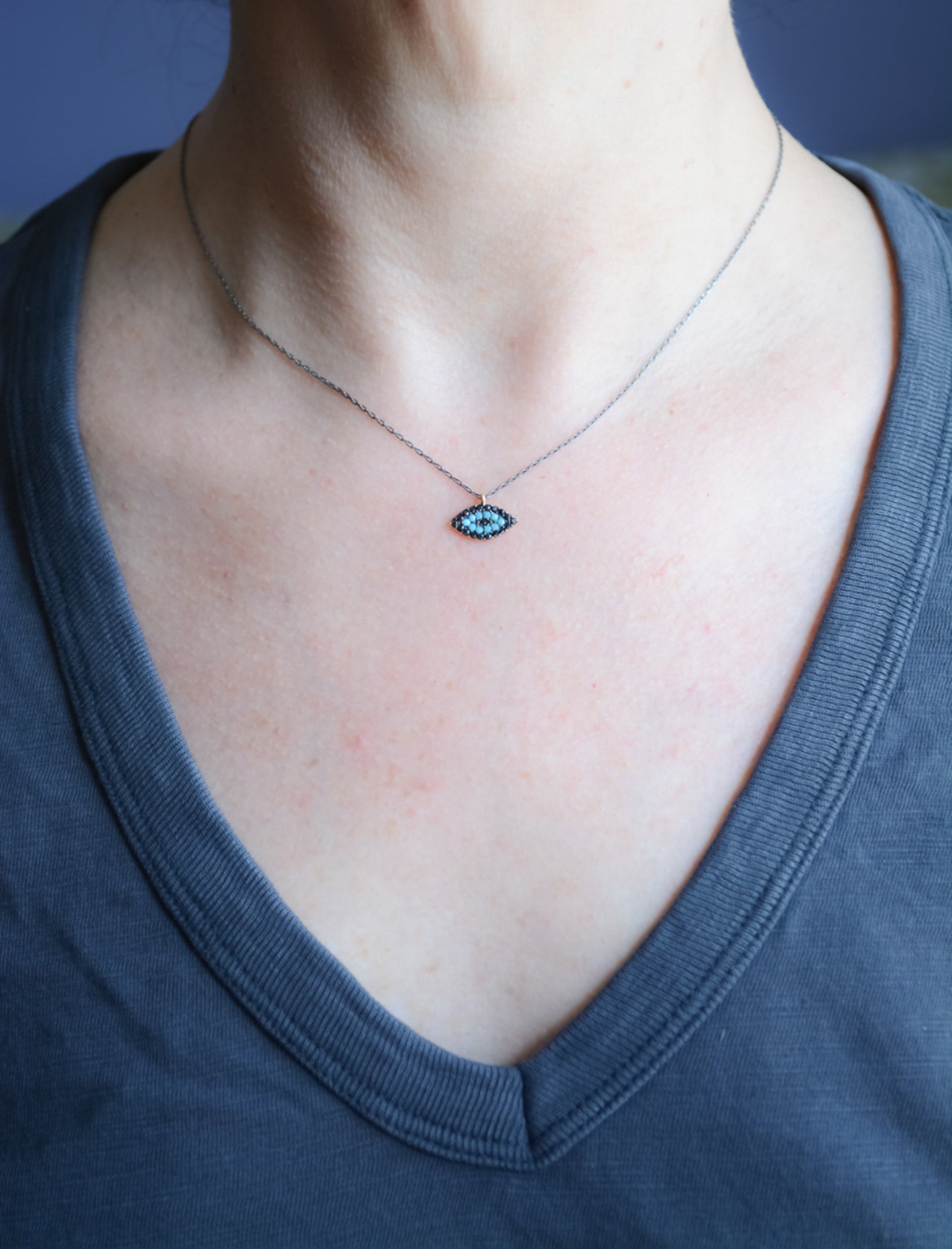 Good luck charm with dark rhodium chain