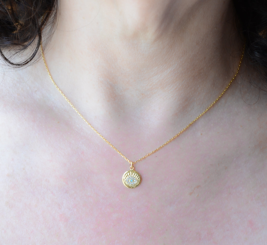 Gold eye necklace with turquoise & cubic zirconia accents