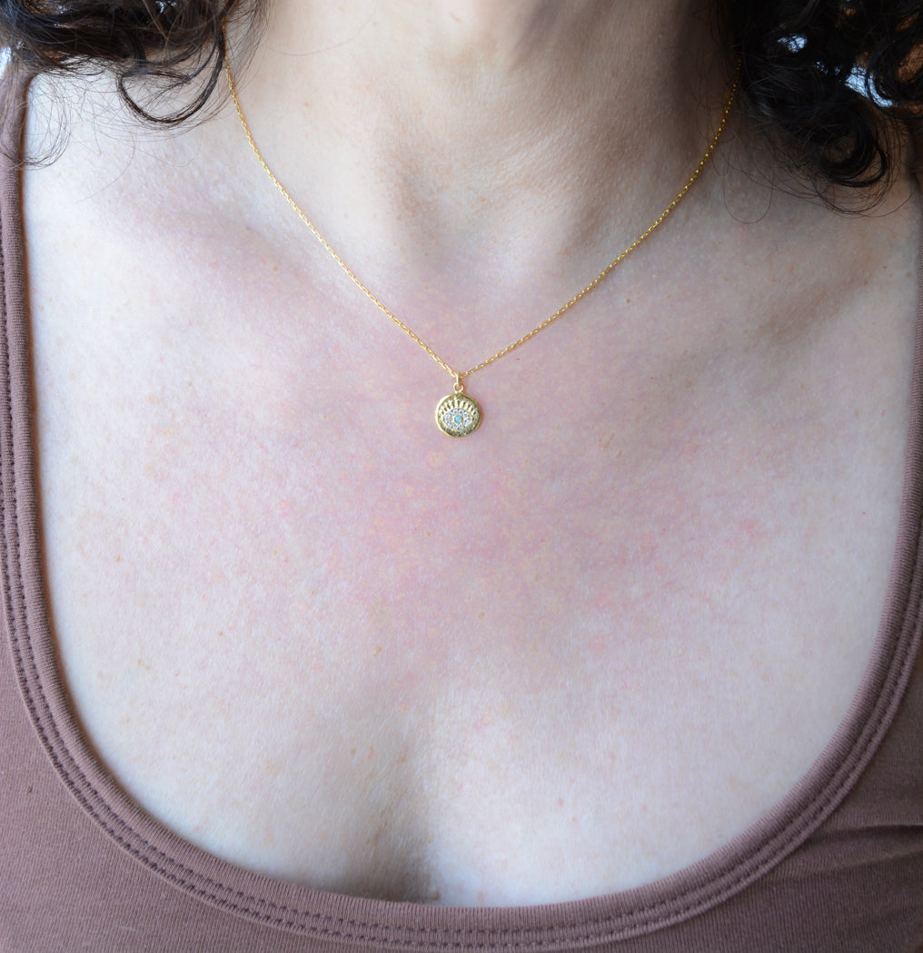 Gold eye necklace with turquoise & cubic zirconia accents