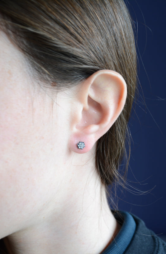 Dark Rhodium sunburst studs with pave cubic zirconia