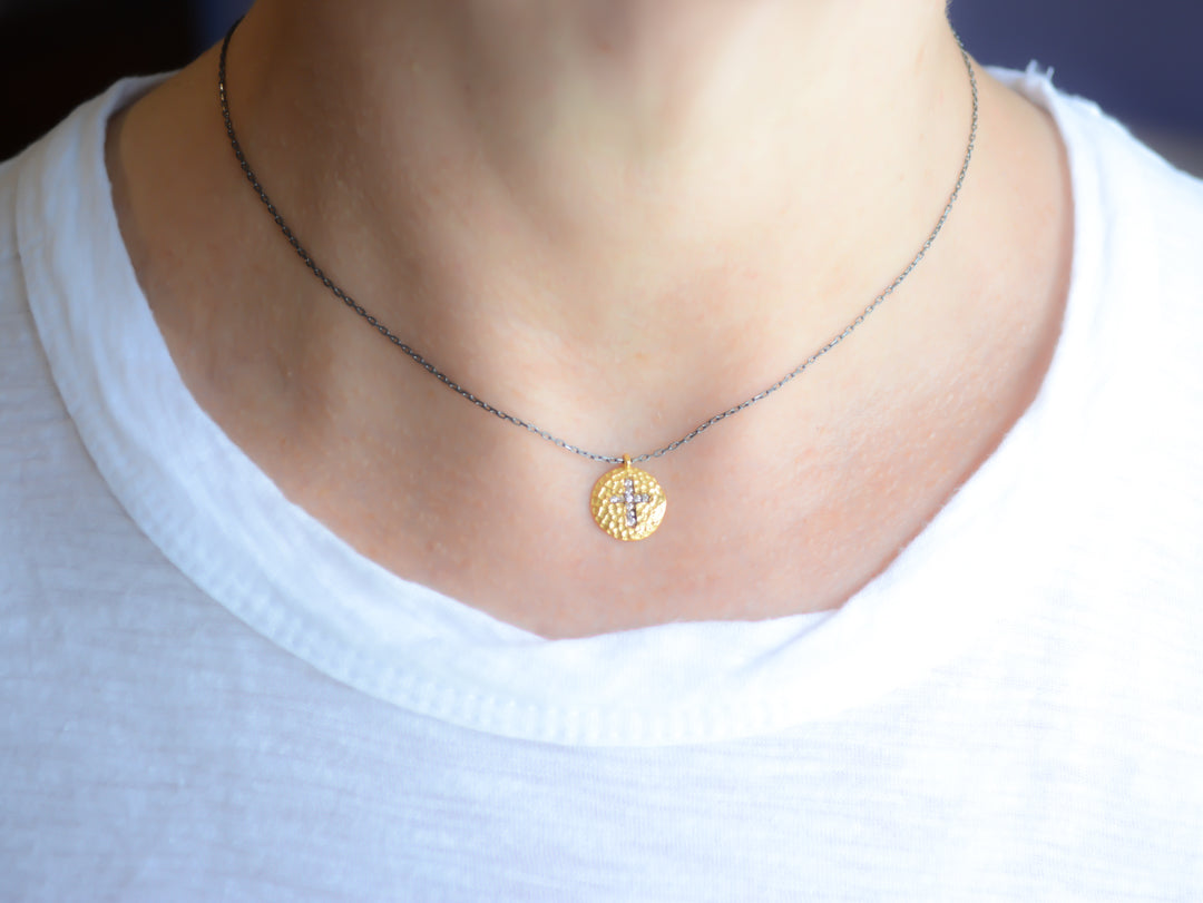 Two-tone cross necklace with cubic zirconia accents