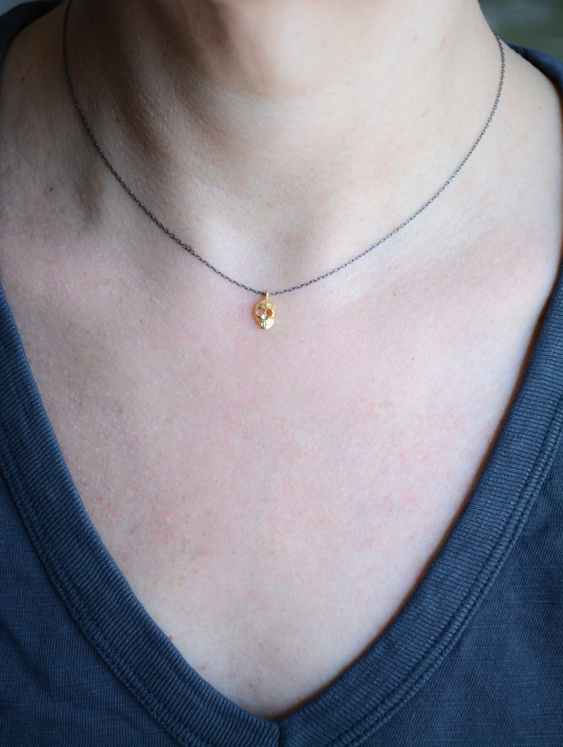 Two-tone sterling silver skull necklace