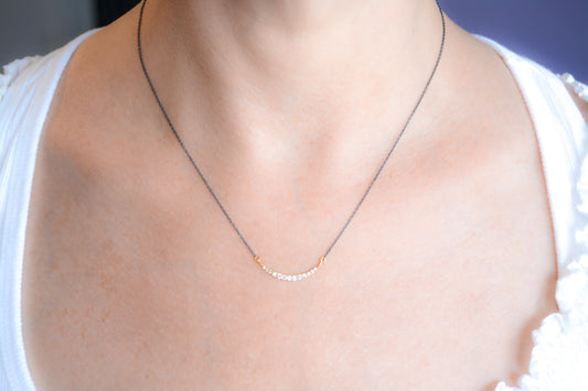 Delicate two-tone cz crescent necklace