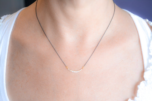 Delicate two-tone cz crescent necklace