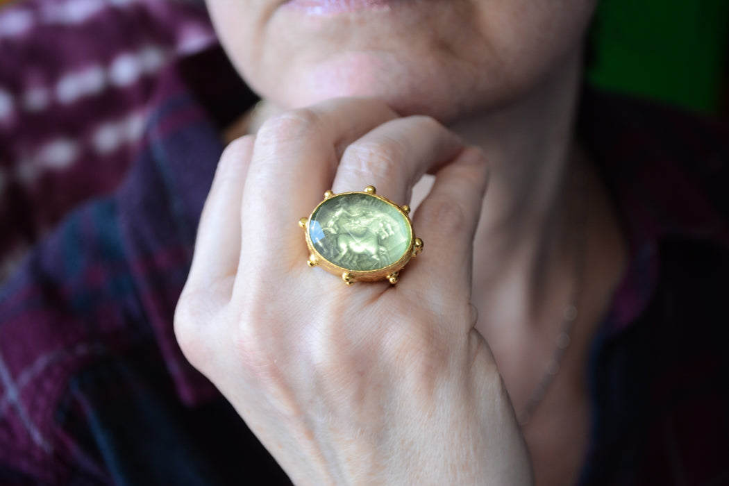 Adjustable gold coin ring with faceted green crystal