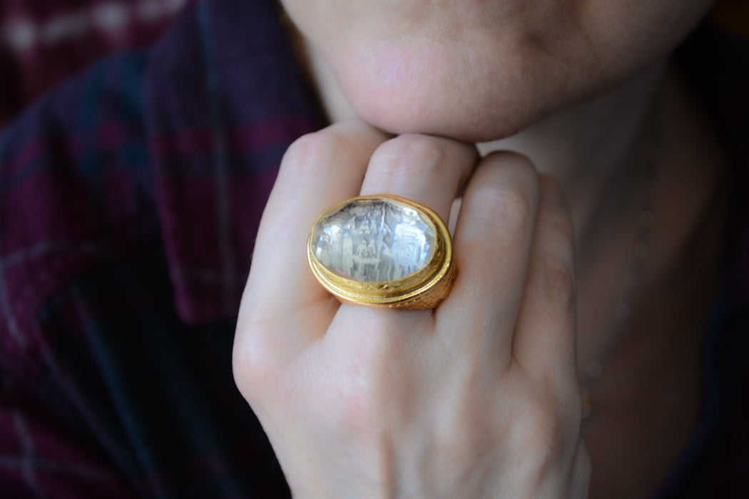 Adjustable gold coin ring with faceted clear crystal