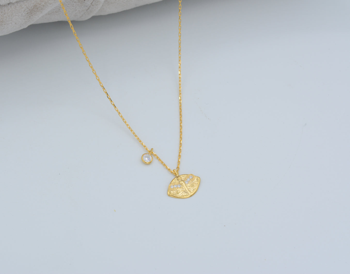 Gold dragonfly  and cubic zirconia charm necklace