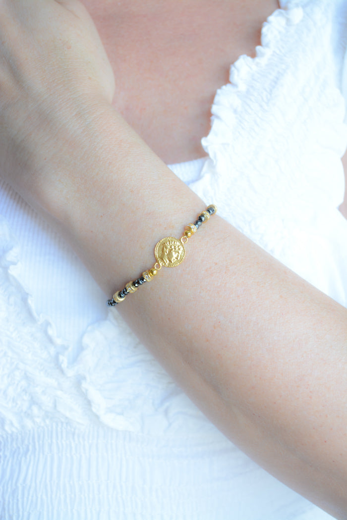 Faceted Hematite and Gold Plated coin bracelet with cz