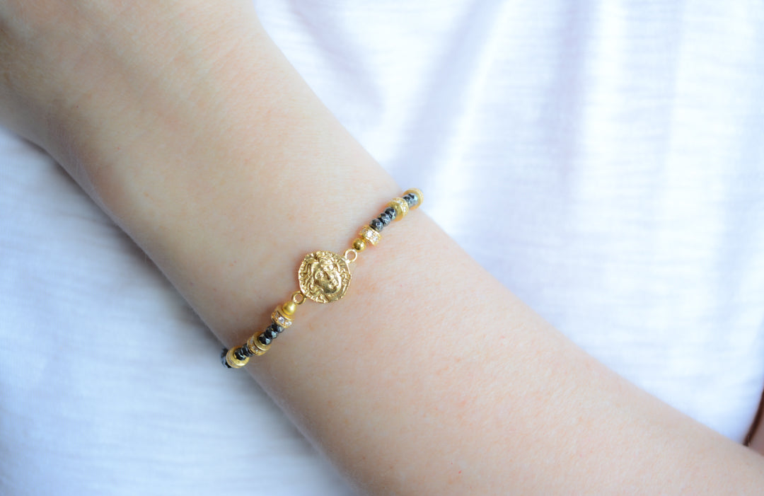 Faceted Hematite, and Gold Plated cz coin bracelet