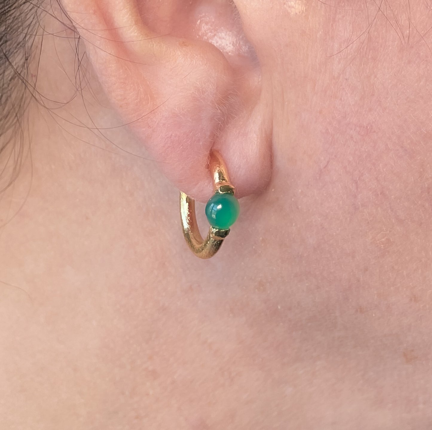 Gold plated textured hoops with green onyx accents