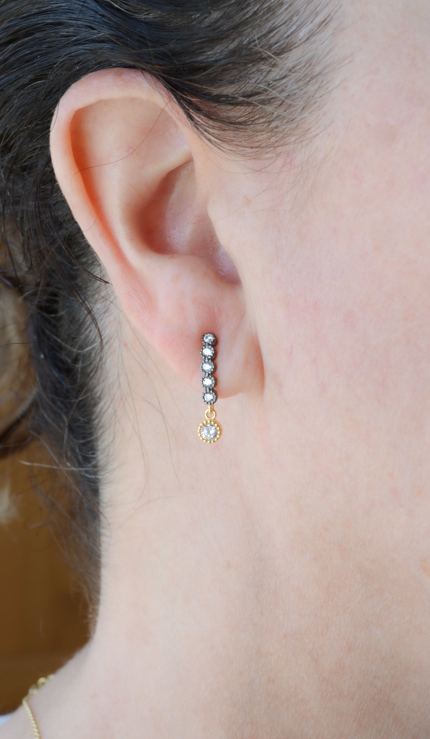 Two-tone earrings with cubic zirconia dangle