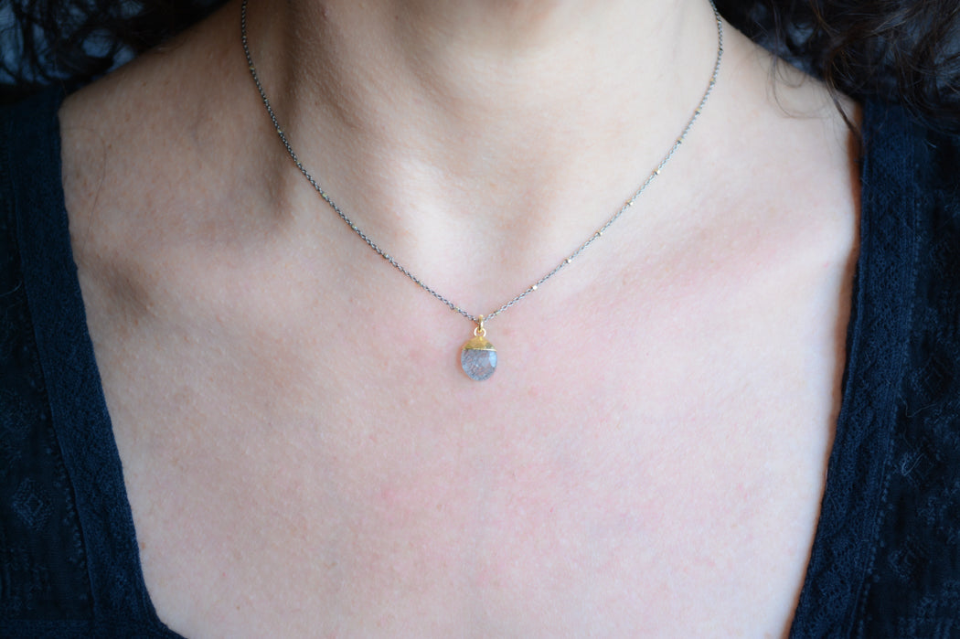 Mix metal necklace with oval black rutilated quartz pendant