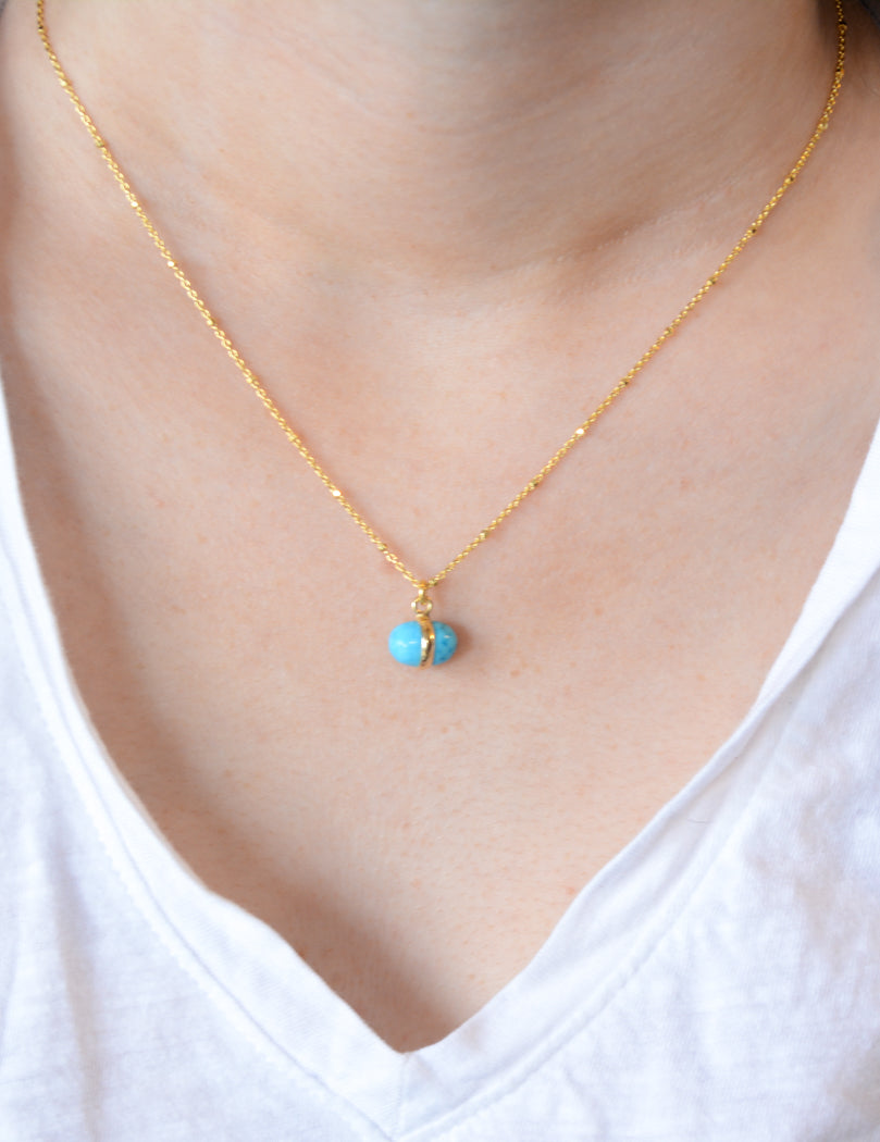 Gold necklace with turquoise charm