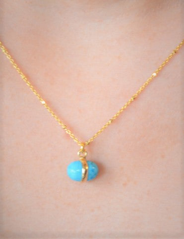 Gold necklace with turquoise charm