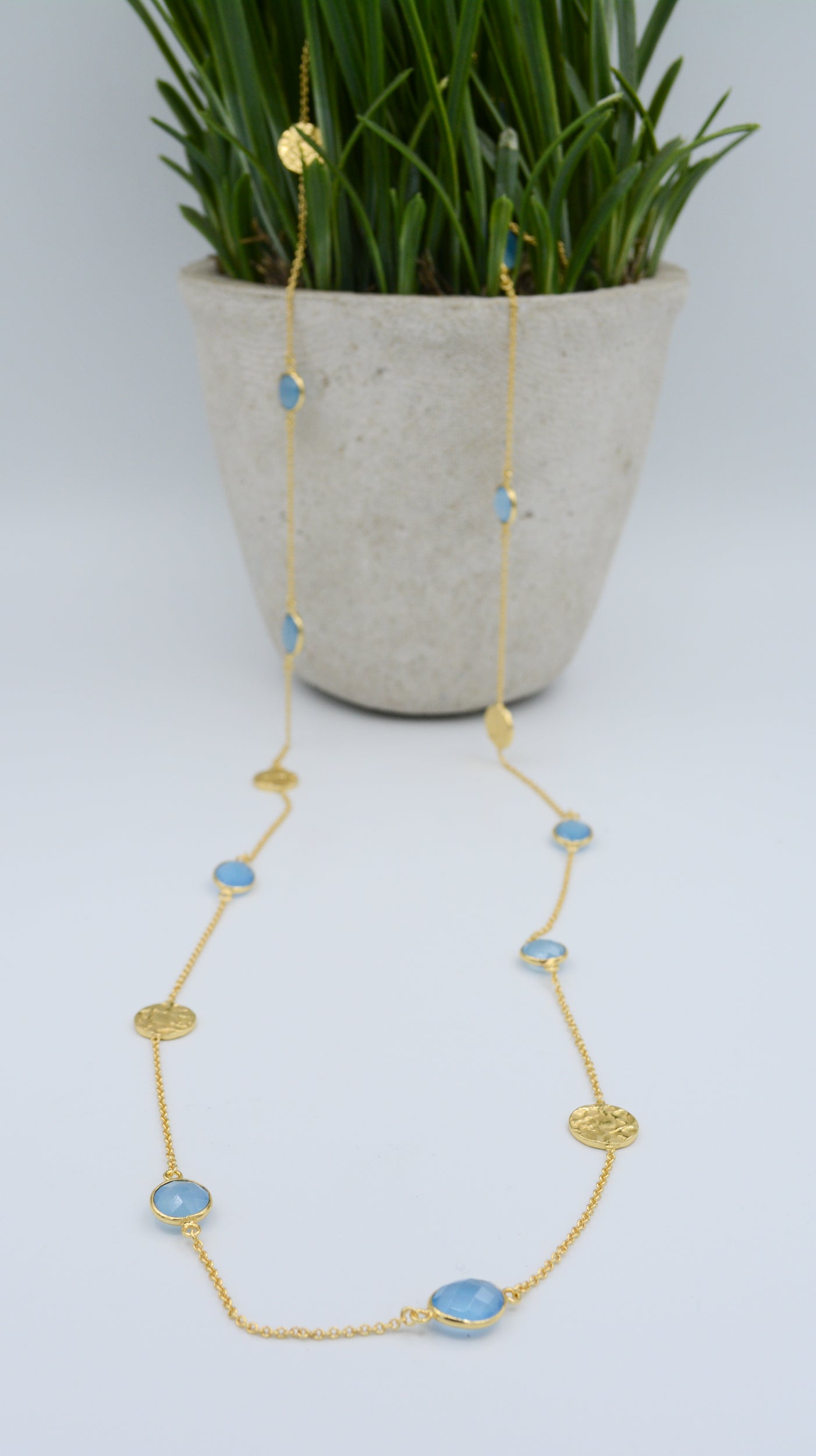 Gold plated blue chalcedony necklace with hammered discs