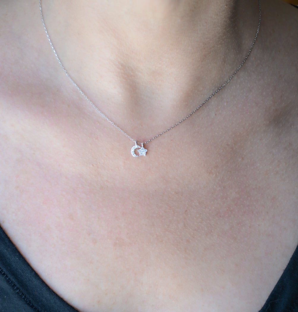 Silver necklace with cubic zirconia moon and star pendant