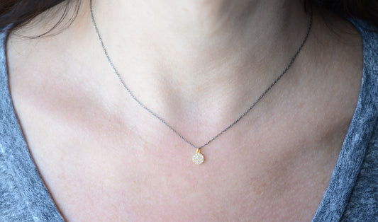 Two-tone necklace with cubic zirconia disc pendant