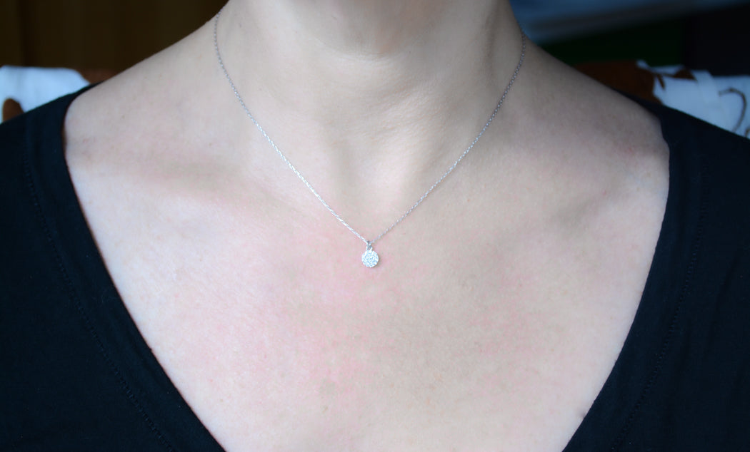 Silver necklace with cubic zirconia disc pendant