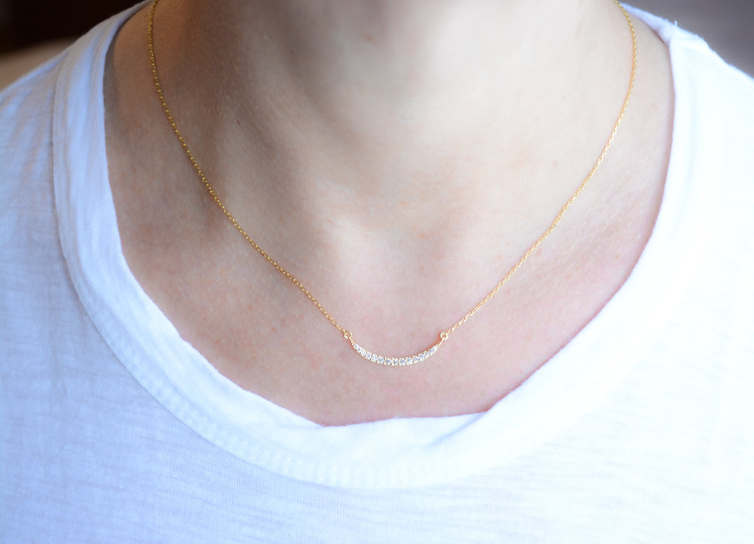 Delicate gold and cubic zirconia crescent necklace