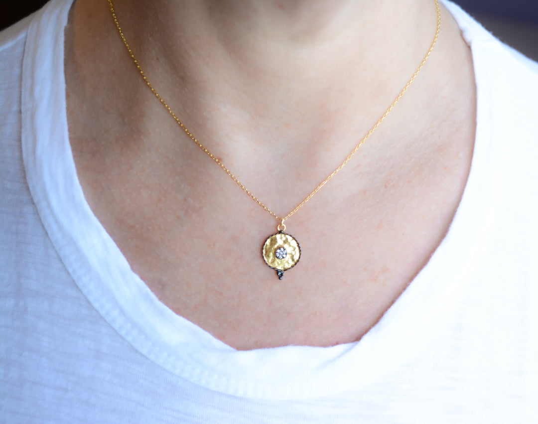 Gold pendant necklace with oxidized pave cubic zirconia accents