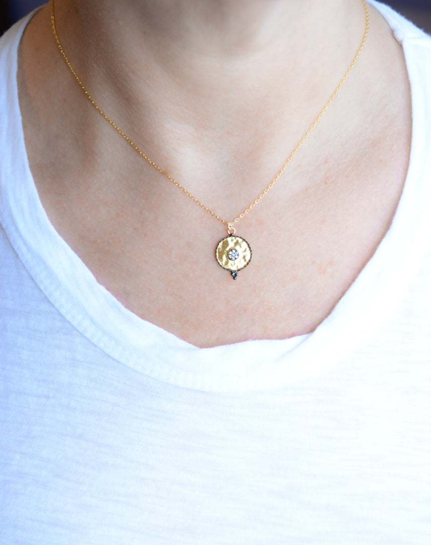 Gold pendant necklace with oxidized pave cubic zirconia accents